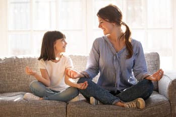 Parent and child meditating